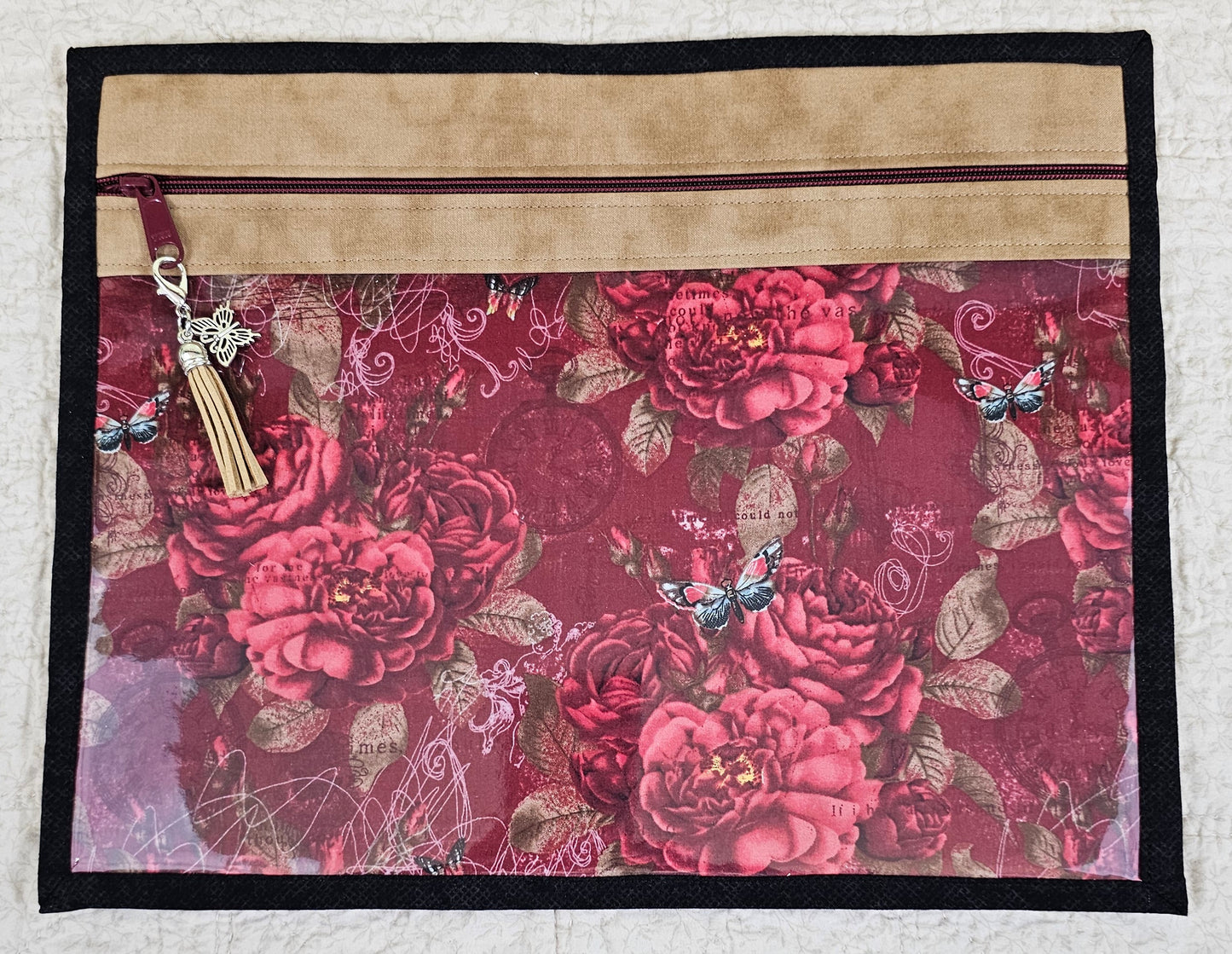 Floral Pattern on dark red fabric with beige trim and black back 11" x 14" Project Bag