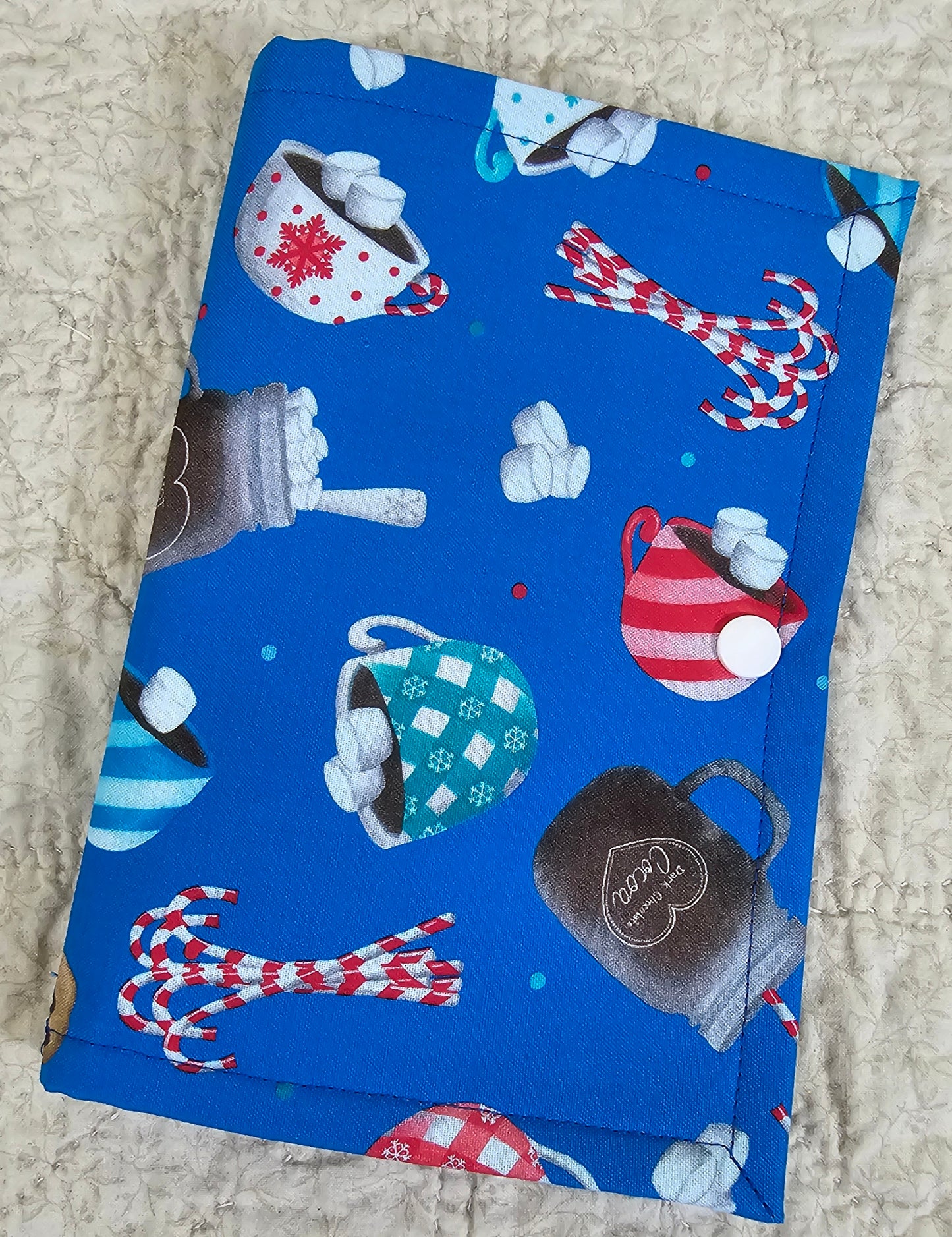 Christmas Treats on Blue Fabric with red snow flake pockets Thread Keeper