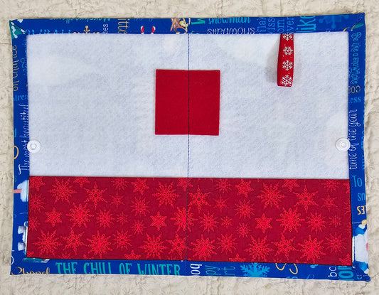 Winter Words on Blue Fabric with red snow flake pockets Thread Keeper